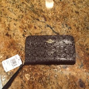 Brand new Coach wristlet with tags!